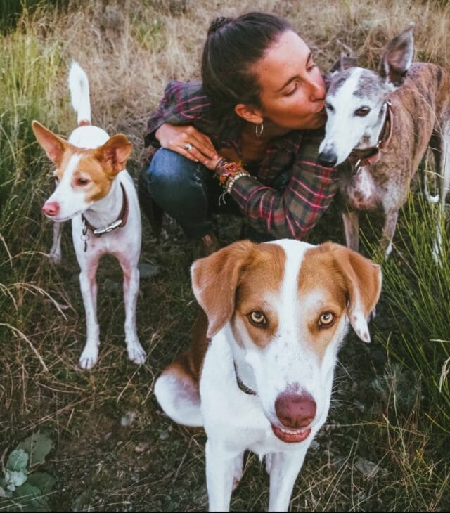 woman and her three dogs