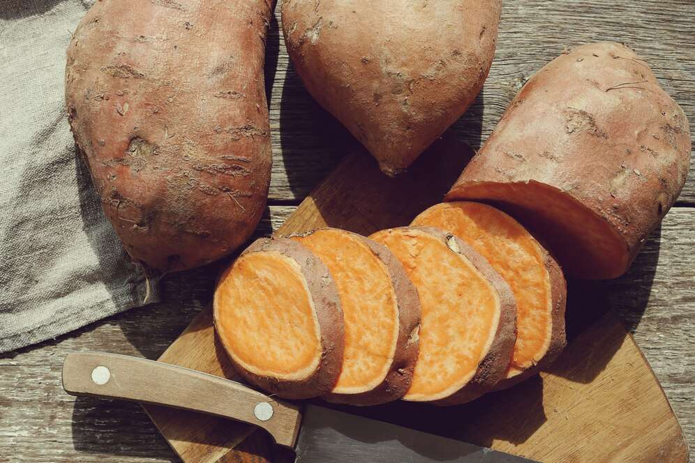 sweet potato whole and sliced for DIY Dog Treats