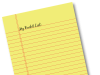 The Ultimate Bucket List for You and Your Dog Bucket list written on a yellow legal pad